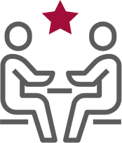 2 Personen führen ein Gespräch am Tisch-Icon